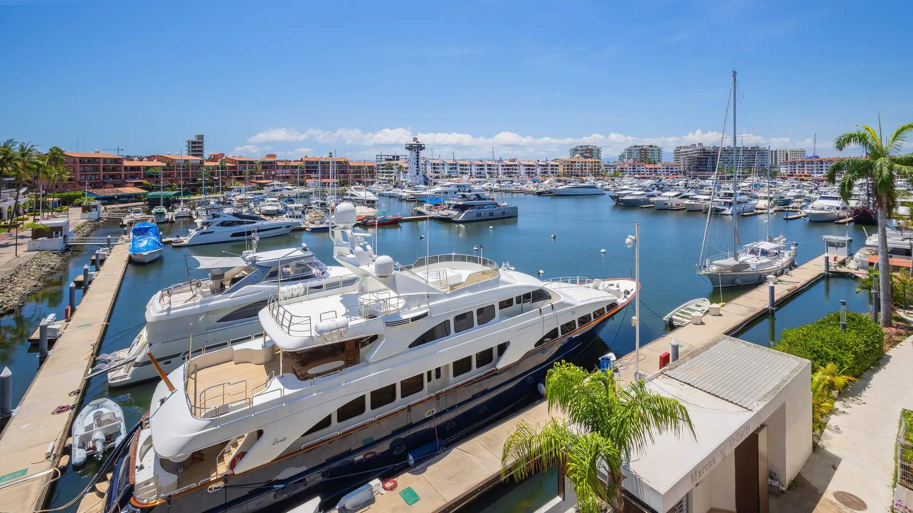 Yachts docked along the boardwalk in Marina Vallarta, Puerto Vallarta