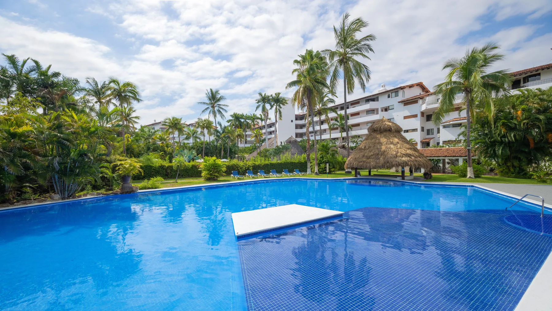 Pool and building facade at Marina Las Palmas