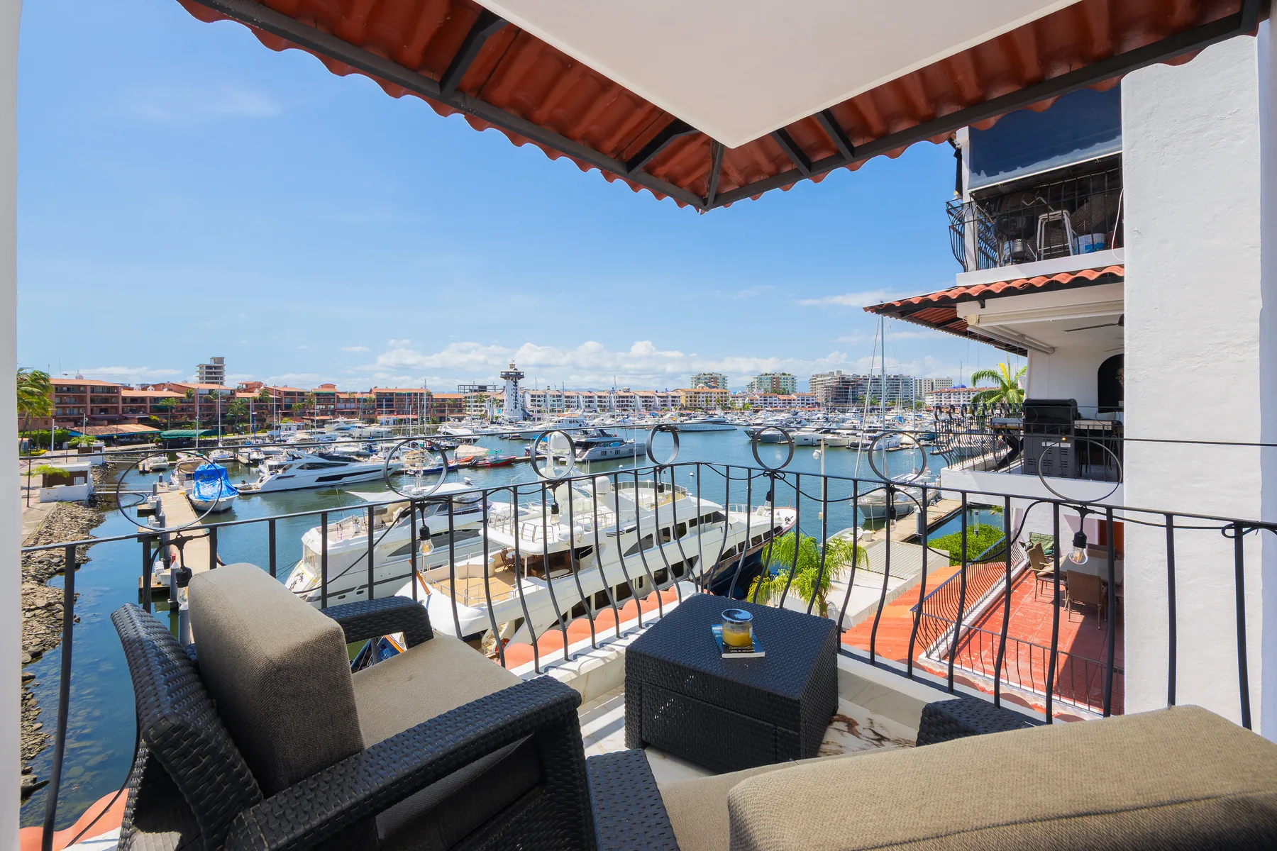 Covered terrace at Las Palmas 313 overlooking the boats in Marina Vallarta