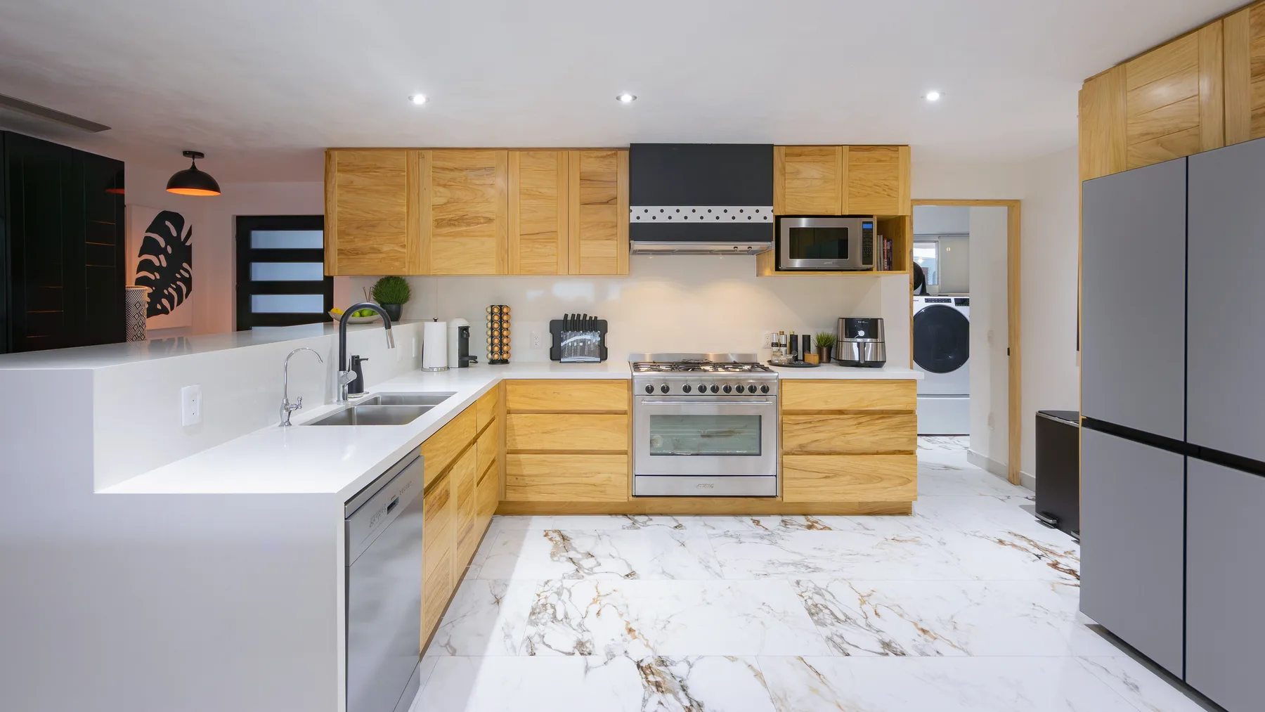 Kitchen with full-size refrigerator and dishwasher