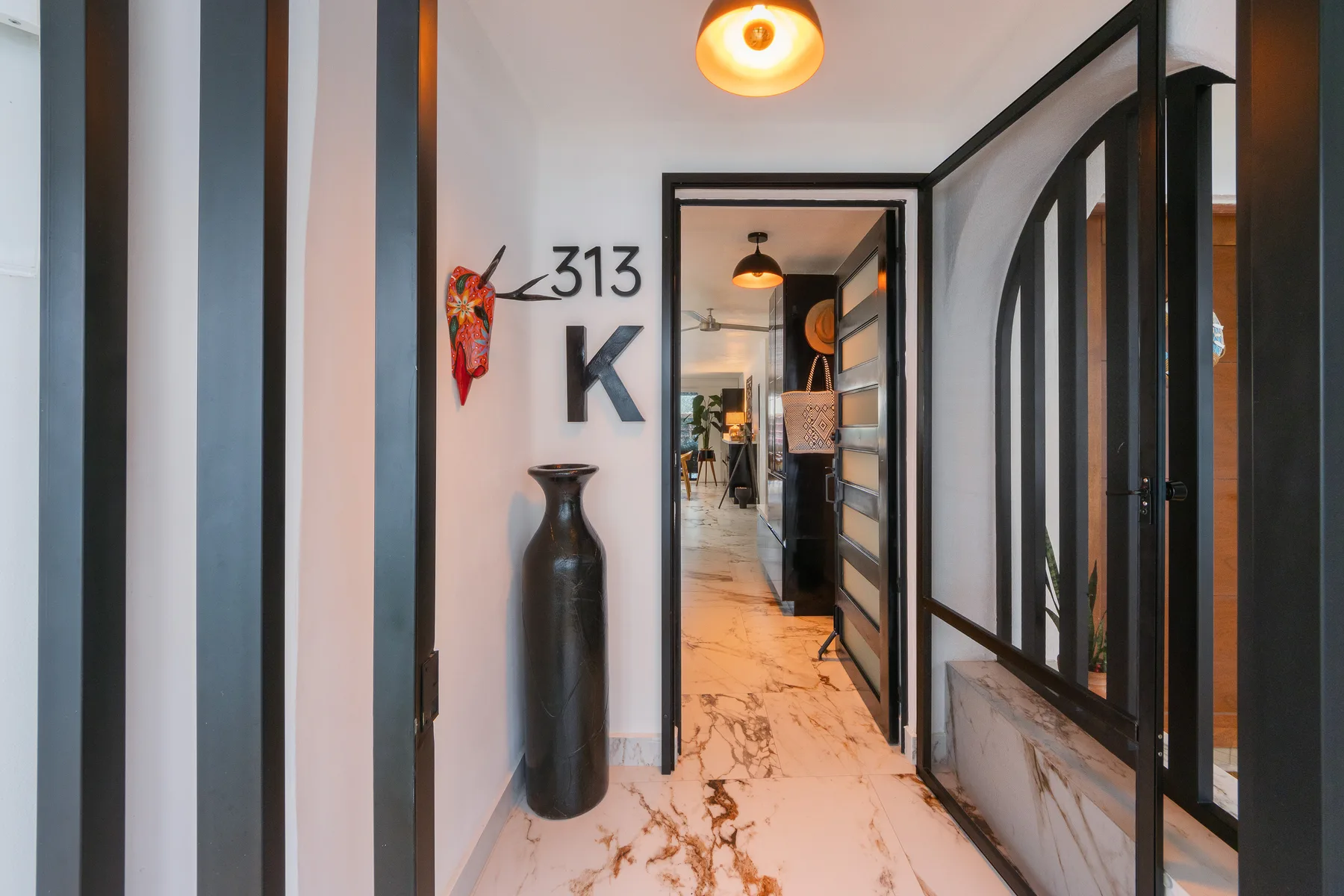 Entry to unit 313 with custom ironwork door